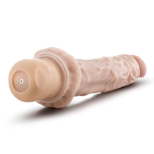Realistic flesh-toned vibrating dildo with veined texture and screw base on white background