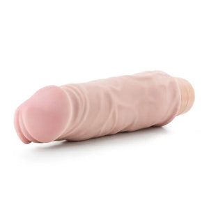 Realistic flesh-colored vibrator with textured veins on white background