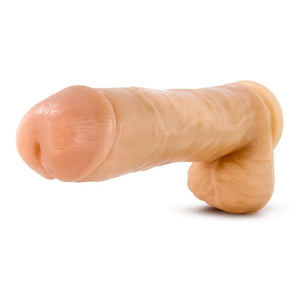 Realistic flesh-toned dildo sex toy with scrotum detail on white background