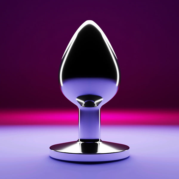Metallic butt plug on a purple background