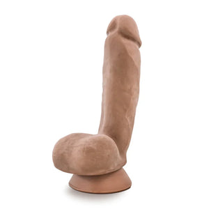 Realistic brown dildo with suction base displayed on white background