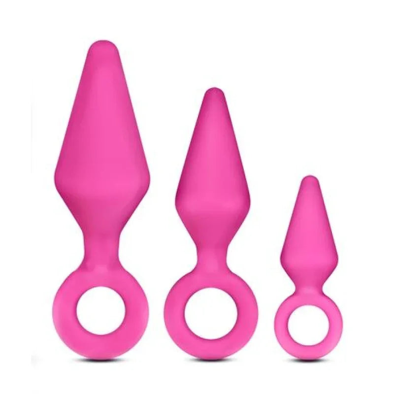 Set of three pink silicone anal plugs with tapered tips and ring handles in small, medium, and large sizes