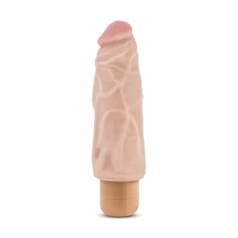 Realistic flesh-colored vibrator with veined texture and blush tip on white background
