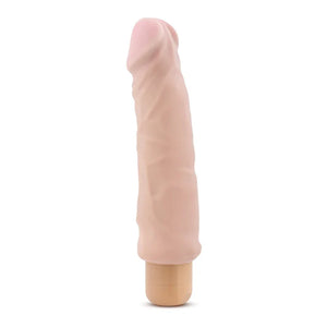 Natural skin tone realistic vibrator with textured shaft and curved tip for adult pleasure