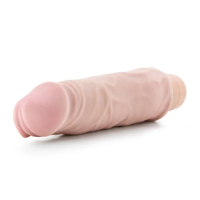 Realistic flesh-colored vibrator with textured veins on white background