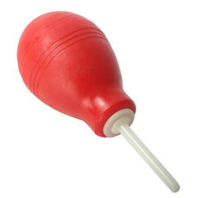 Red bulb enema syringe with white plastic nozzle for cleansing and anal care