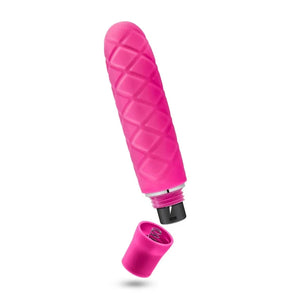 Pink mini vibrator with textured diamond pattern and removable battery cap on white background