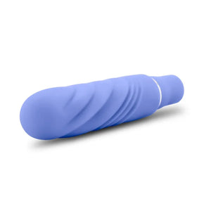 Compact periwinkle blue vibrator with textured spiral design on white background