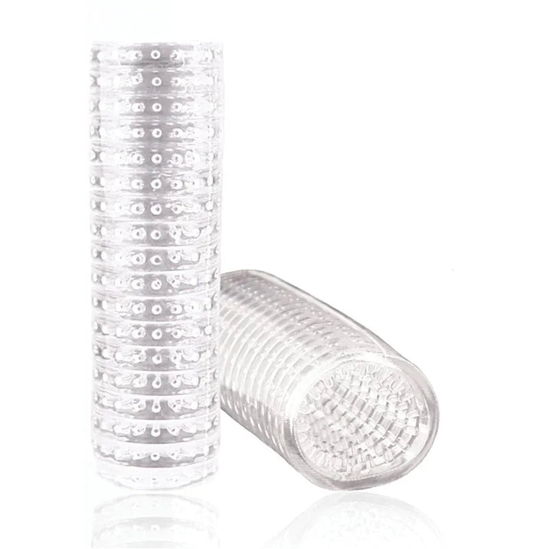 Two transparent textured male masturbation sleeve aids with raised nubs and rings on white background